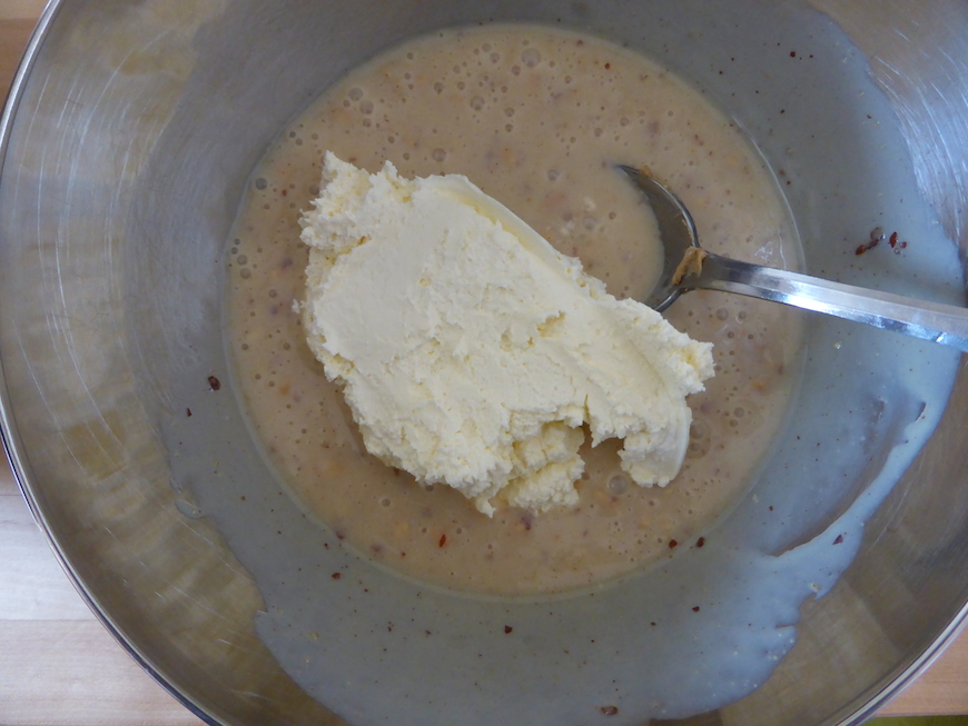 Transfer of a third or so of the whipped cream to the peanut butter mix  for the peanut butter ice-cream recipe.