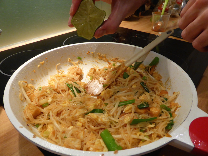 Adding lime to the pad thai
