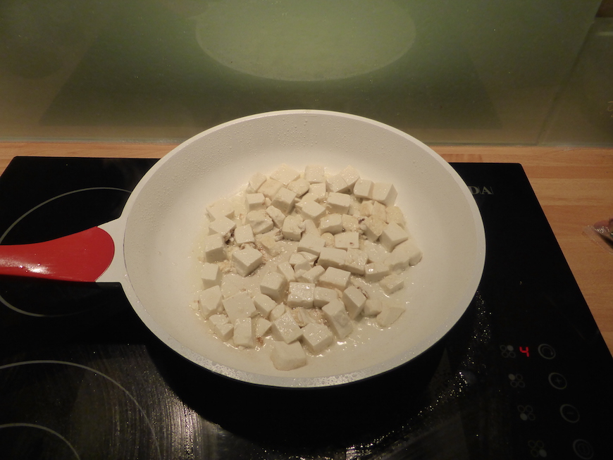 The tofu tossed in the pan